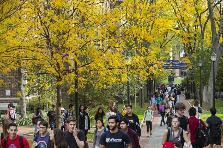 students in fall on locust walk.